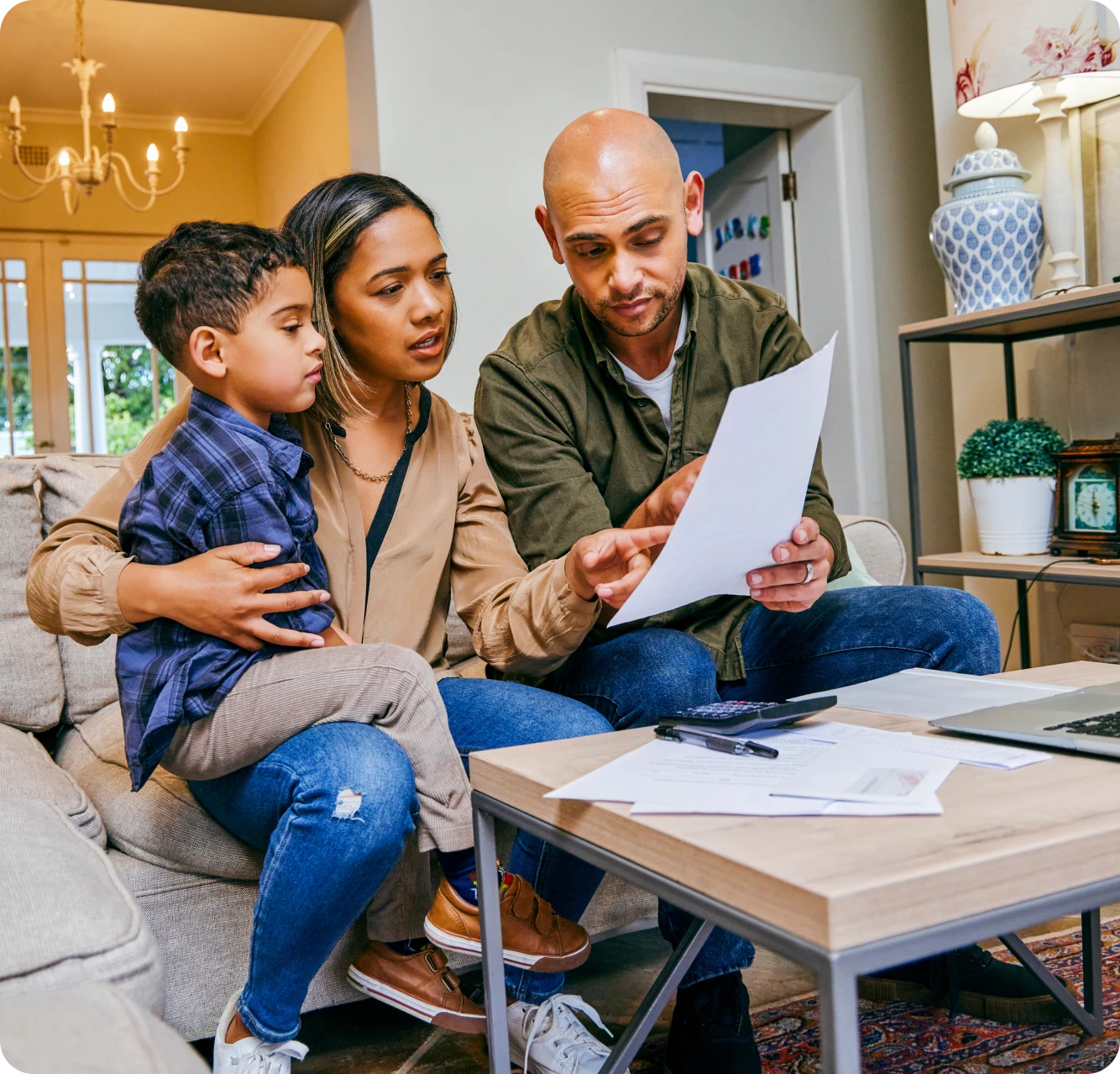 Family reviewing documents in living room