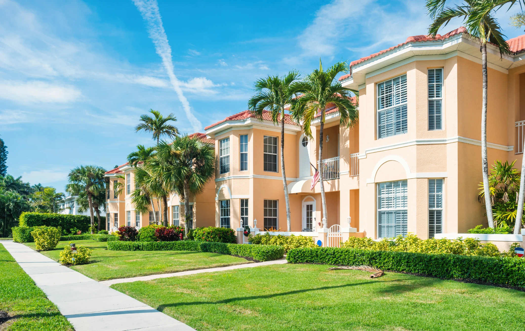 Modern townhouses with manicured lawns